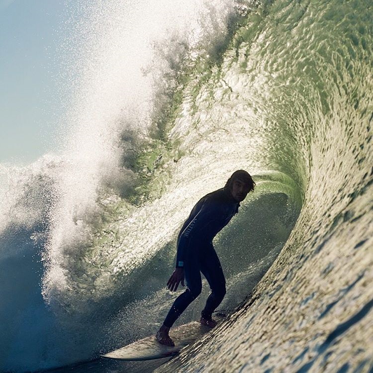 Surfer Bummy Koepenick on a wave by Seth DeRoulet