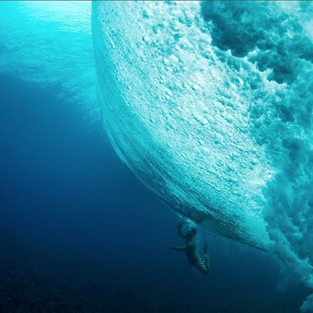 Under water inside a big wave in Tahiti. Photo by Seth DeRoulet