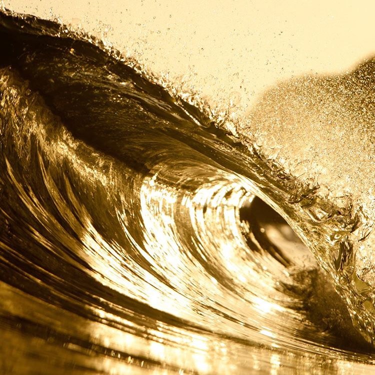 The golden glow of a Santa Barbara evening on an ocean wave. Photo by Seth DeRoulet