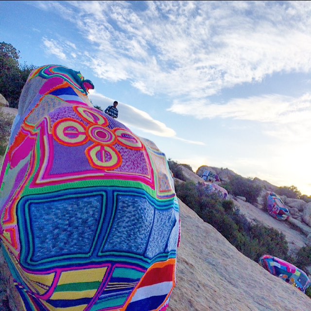 18 massive boulders at Lizards Mouth in the mountains above Santa Barbara wrapped with fiberart. 7 months of work on exhibit for a total of 4 days before disappearing forever without leaving a trace. No revenue, no commerce, just drawing thousands of people back to nature with a whimsical explosion of color in the wilderness.