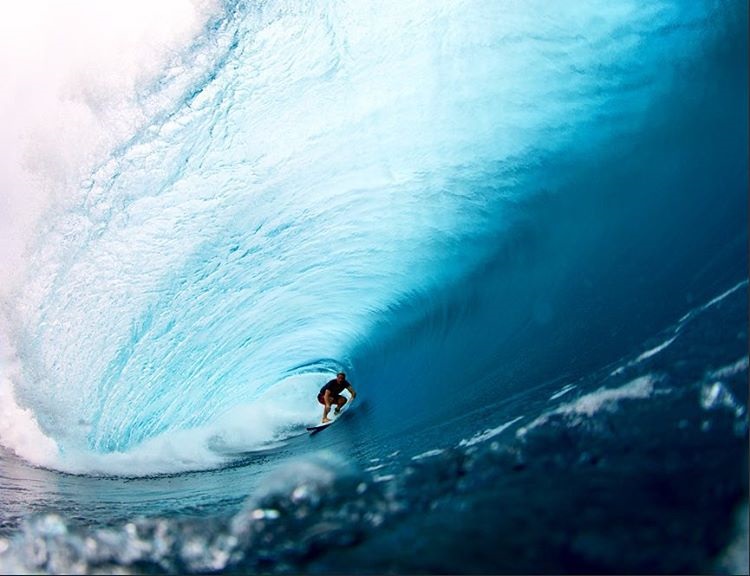 Andrew Bennett surfing a wave in Teahupoo in Tahiti. Photo by Seth DeRoulet